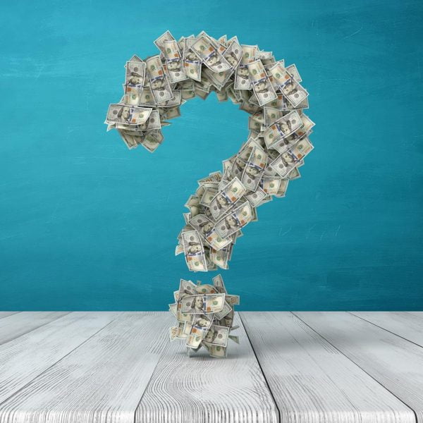 Money gathered in the shape of a question mark