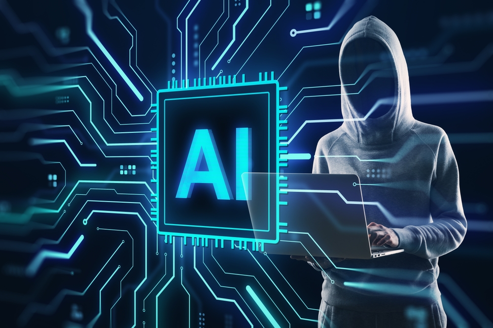 A person in a hoodie uses a laptop in front of a digital graphic showing a glowing AI chip surrounded by circuitry, symbolizing artificial intelligence and cybersecurity concepts.