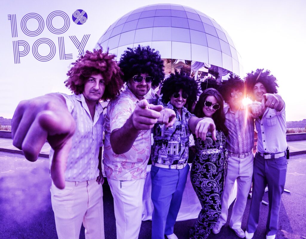Six people in 1970s disco outfits and wigs pose in front of a mirrored dome. They point toward the camera. Purple tones dominate. The text 100% POLY appears in the upper left corner.