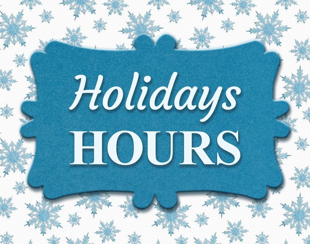 A blue decorative sign with the words Holidays Hours in white text, set against a background with light blue snowflakes.