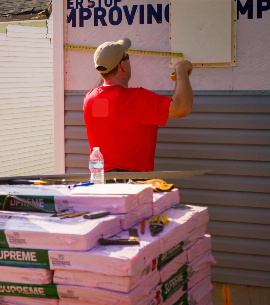 Axiom team measures siding to help Habitat for Humanity