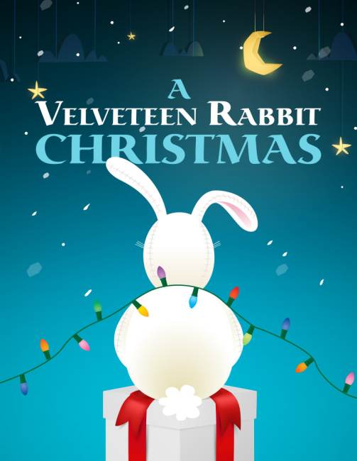 A white stuffed rabbit sits on a gift box wrapped with a red ribbon, covered in colorful Christmas lights, with the text A Velveteen Rabbit Christmas above on a blue, starry background.